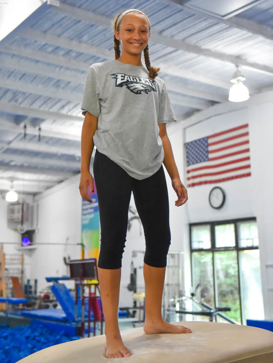 Teen girl standing on a mount