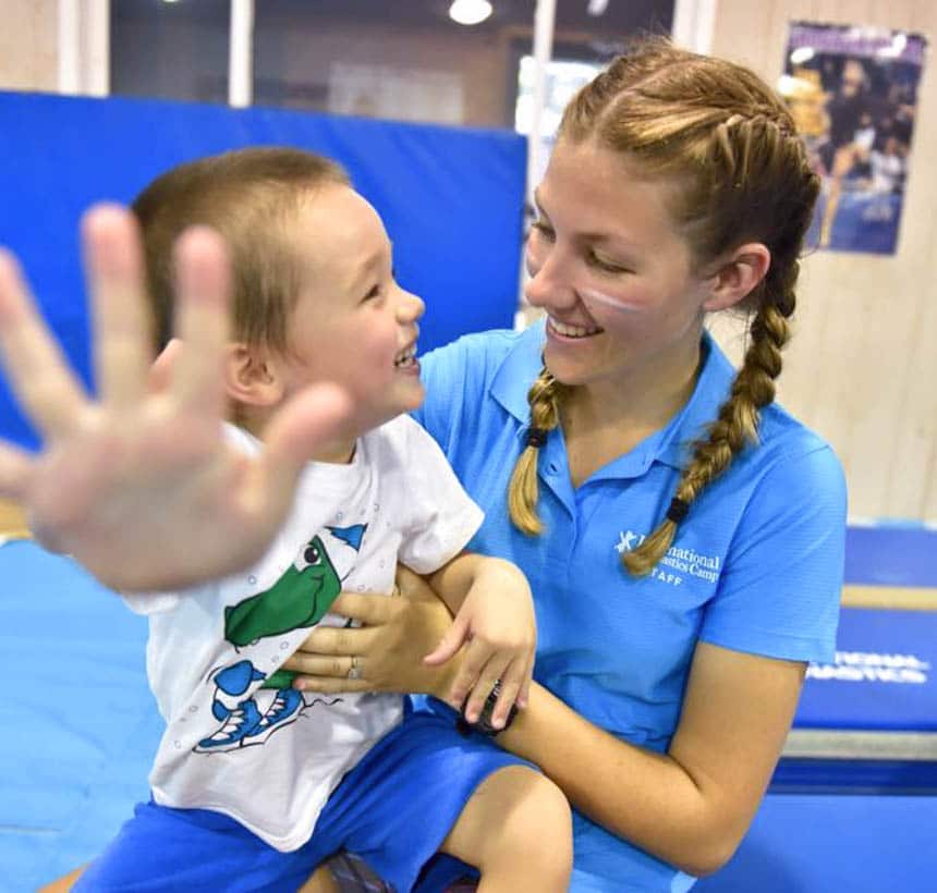 Toddler with a coach in class